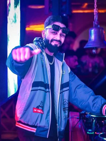 Pointing to the party people. My goal is to make you smile and dance, and I love seeing that energy reflected back from the crowd.