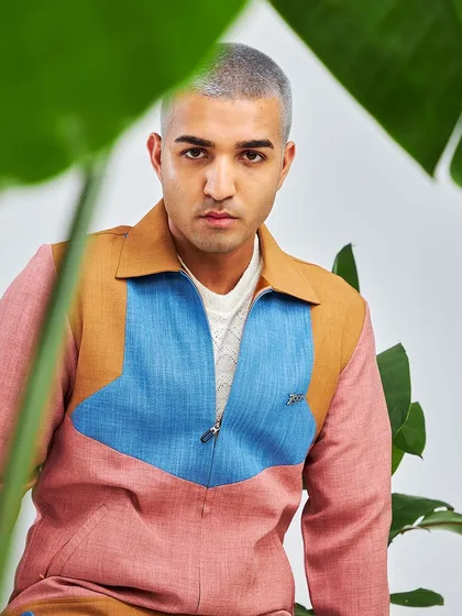We aren't missing out on the summer spirit. This color-blocked shacket in pink, blue, and tan is for those who love vibrant hues and contemporary chic style.
