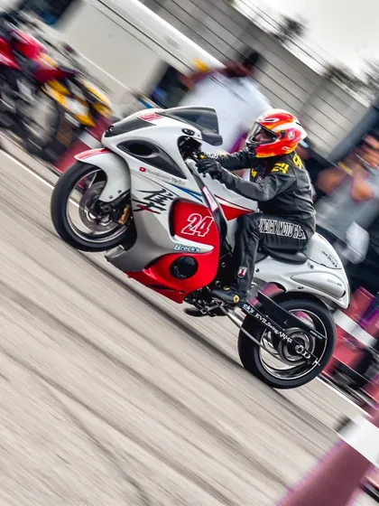 A Suzuki Hayabusa, the legendary "Busa," performs a power wheelie at launch. This iconic superbike is always a crowd-pleaser and a formidable competitor on the drag strip.