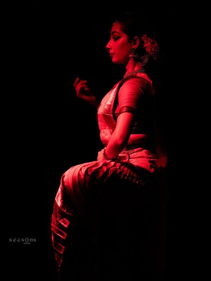 A silhouette of my performance as Kāli, lit in red to represent her fierce and untamed energy. Exploring the different facets of a single deity through dance is a fascinating journey.
