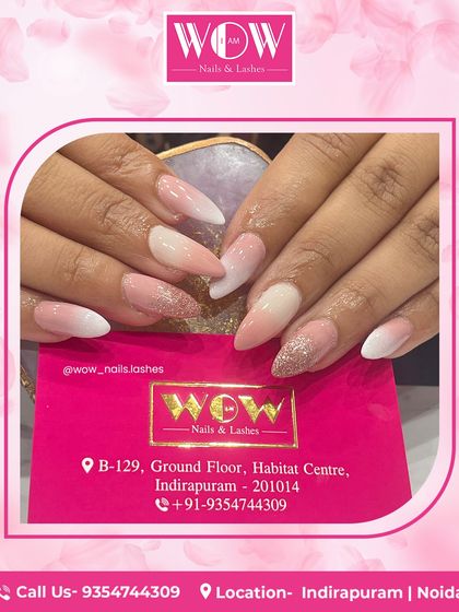 A soft and elegant ombré on almond-shaped extensions. The design fades from a gentle pink to a classic white, with a touch of glitter on the accent nail for a bit of sparkle.