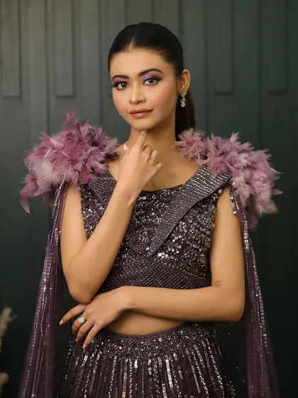 This look is for the client who isn't afraid to make a statement. The combination of a bold, colorful eye and a high-fashion outfit is perfect for a themed party or a dramatic sangeet.