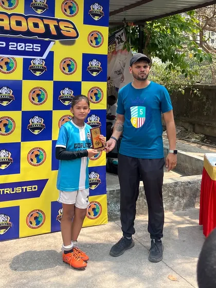 One of our talented girl players receiving an individual award at the Grassroots Super Cup 2025 for her excellent performance.