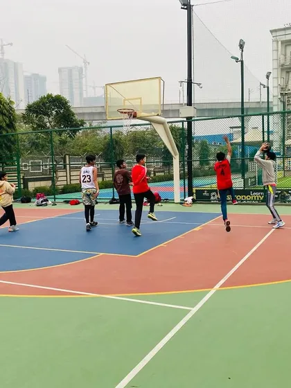 A player takes a jump shot from the wing.