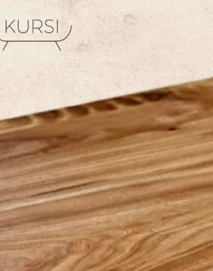 The smooth, polished surface of a live-edge teak tabletop. It's where the raw beauty of the wood meets refined craftsmanship, creating a surface that is both beautiful and functional.