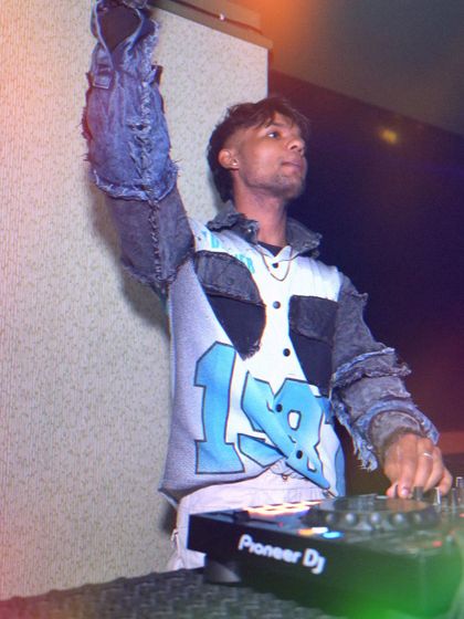 Hand up, feeling the vibe. I love to move and dance along with the crowd.