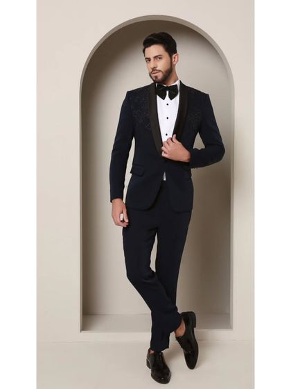The complete ensemble of the Prism Riviera tuxedo, showing the balance between the embellished jacket and the clean lines of the coordinating trousers. This is modern elegance personified.