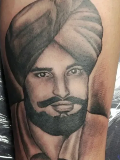 A close-up of a realistic portrait tattoo. My focus is on creating detailed, lifelike images that serve as lasting memories for my clients.