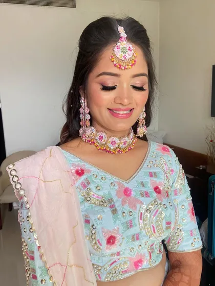 Pooja's smile is the best part of her beautiful mehendi look.