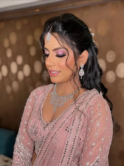 A serene shot of Garima, with her eyes closed, showcasing the beautiful blend of the pink eyeshadow.