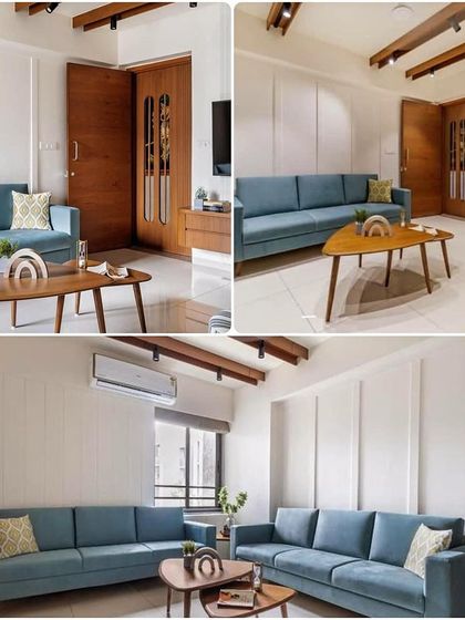 When an interior is designed around a theme, this is the look we achieve. This living room features a cohesive design with a simple blue sofa, mid-century modern coffee table, and elegant wall beading.