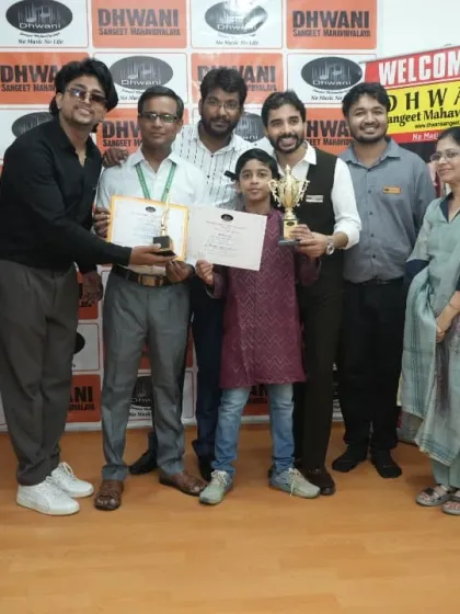 The whole team of teachers congratulates a student on her achievements.