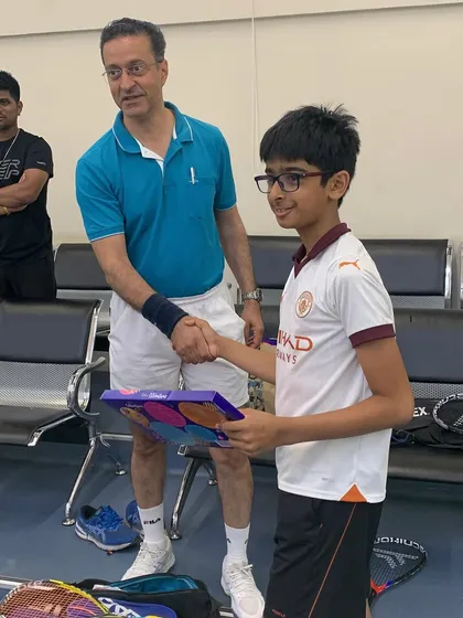 The winner of the Willingdon Squash Academy tournament, Uttkarsh Jatia, receives his award.