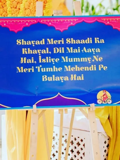 A fun and filmy welcome sign for the Mehendi, setting a playful tone.