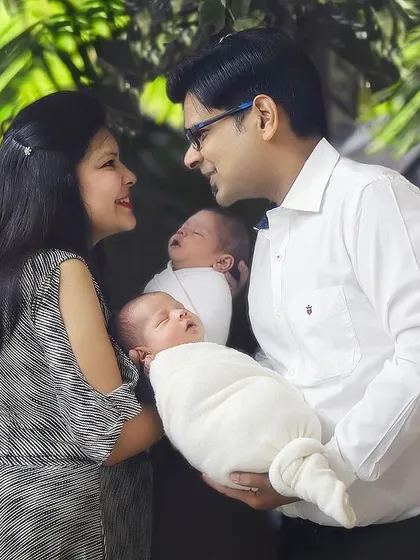 A sweet, candid moment between parents as they hold their newborn twins. I love capturing these natural interactions that show the love and happiness of a growing family.