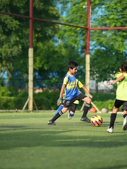 Football for life. A young player in goal during a practice match.