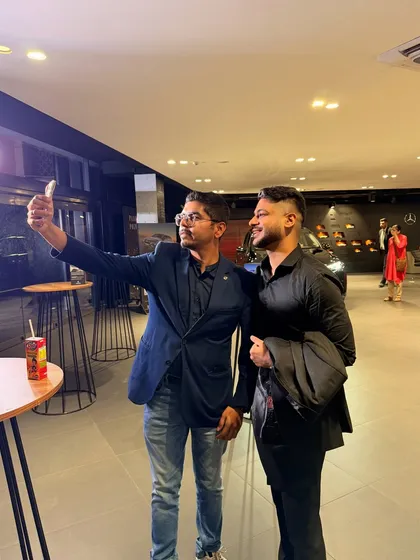 Taking a selfie with a happy guest at a Mercedes-Benz event. My strolling magic is all about creating personal connections and making sure every attendee feels like they've seen something special.