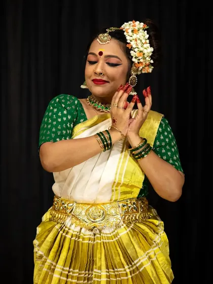 The hands and face work in harmony to tell a story. This is a moment of 'abhinaya' or expression from a student's solo recital.
