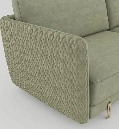 A closer look at the Paris Sofa's ever-exotic quilted arm, a detail that adds a layer of texture and sophistication. The elegant metal legs complete the stylish look.