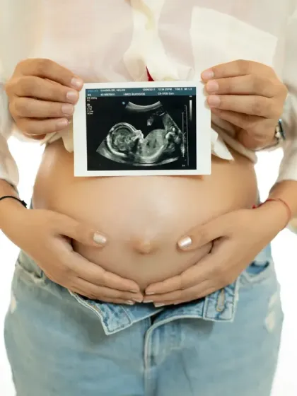 The first picture of your baby. This classic shot features the sonogram held over the baby bump, a simple and powerful way to announce and celebrate the new life on the way.