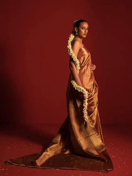 The saree is a canvas of endless possibilities. For this campaign, I focused on a modern interpretation of traditional elegance, using a rich, golden Kanchipuram silk saree and minimalist styling to create a look of pure grace.