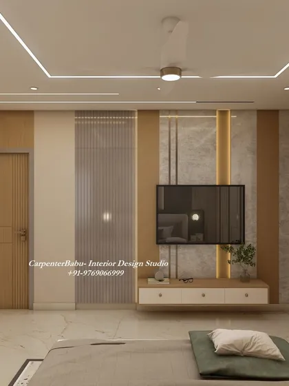 The TV unit in this bedroom is simple and functional, with a floating console and a textured back panel. The design is minimalist and allows the other elements in the room to shine.