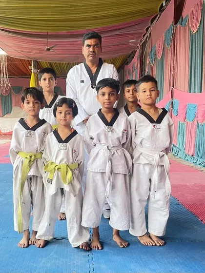 A group of our youngest students with their new yellow belts after successfully passing their first promotion test.