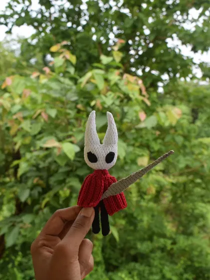 Bringing Hornet from the indie game Hollow Knight to life was a fun challenge. This amigurumi figure is made with wired limbs so you can pose her, complete with her iconic needle. A perfect desk buddy for any gamer.