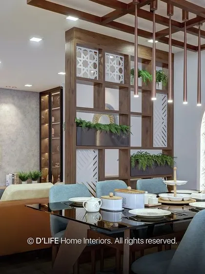 The dining area in this Madurai home, with its black-themed table and star-like lights, creates a mesmerizing atmosphere for meals, perfectly blending drama and elegance.