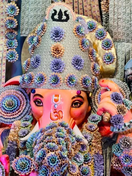 A close-up view of the Lord Ganesha idol, where the mukut (crown) and garlands are intricately crafted from folded currency notes. This highlights the detailed artistry and devotion I bring to every aspect of my decoration work.