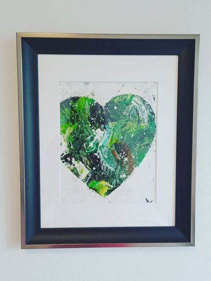 A duplicate of the framed green heart, showing its readiness to bring a touch of nature and abundance to any wall.