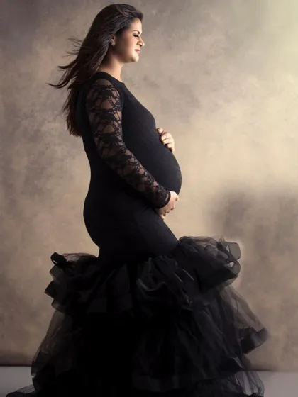 In the quiet of my studio, we can create powerful, fine-art portraits like this. The focus is entirely on you, your strength, and the beautiful shape of motherhood, captured in a classic, elegant style.