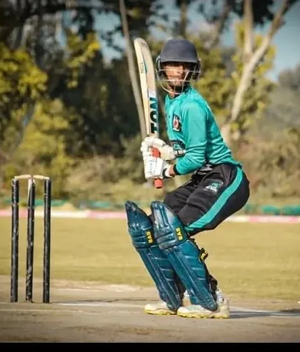 A batsman, focused and ready at the crease during a competitive match. Our training camps emphasize real match preparation, ensuring every player develops the technique and temperament to face any bowler with confidence. This is where practice meets performance.