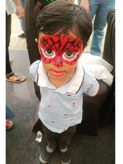 A classic Spiderman full-face transformation, always a huge hit at birthday parties! I use vibrant, safe red and black paint to create the iconic web design, making sure every child feels like a real superhero.