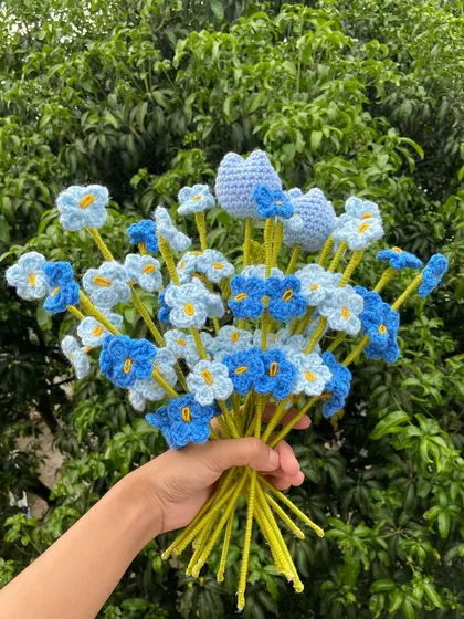 A beautiful blue-themed bouquet with forget-me-nots and heart-shaped flowers.