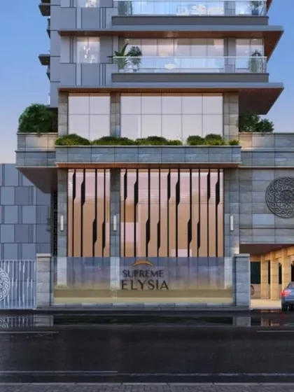 The entrance detail of Supreme Elysia in Mumbai. The vertical fins create a dynamic pattern of light and shadow, providing a contemporary and sophisticated welcome that complements the building's stone and glass facade.