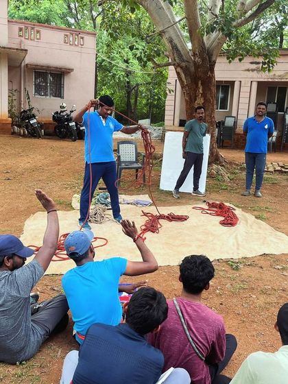 An instructor demonstrates different types of knots and rope management techniques, a fundamental skill for any climber.