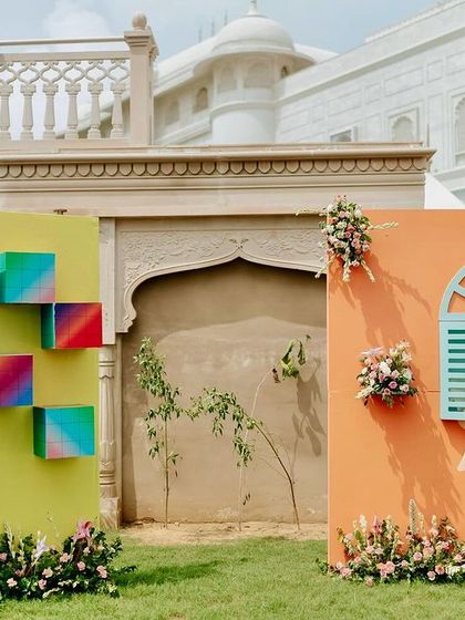 Interactive and colorful photo backdrops designed for a fun carnival Mehendi, encouraging guests to take memorable pictures.