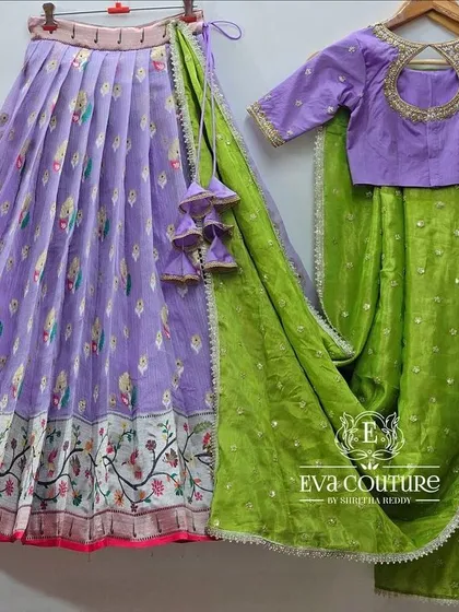 A full view of the lavender and green lehenga set.