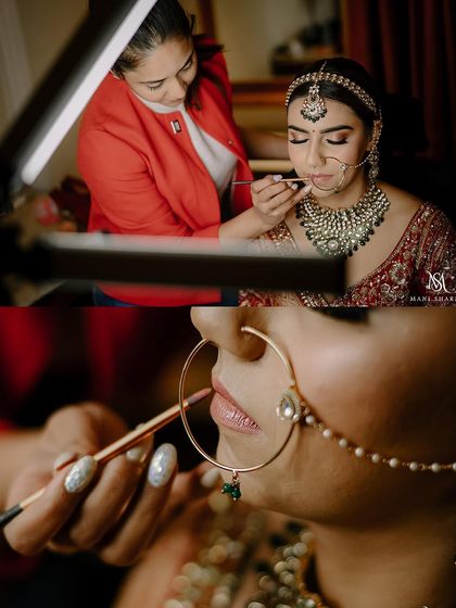 A behind-the-scenes shot of the makeup artist giving the final touches. This shows the process and care that goes into creating the perfect bridal look.