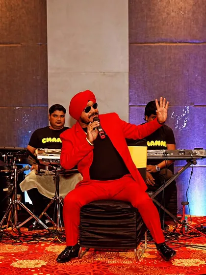 We cover all aspects of your event, including live entertainment. This shot of a singer and his band performing on stage demonstrates our skill in capturing the vibrant atmosphere of corporate event performances.