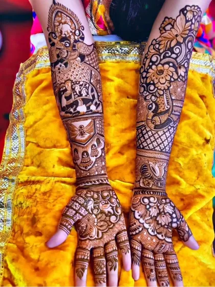 This full-arm design is a work of art, combining figurative work with traditional patterns. The arms depict various wedding scenes and symbols, making it a narrative piece for the bride.