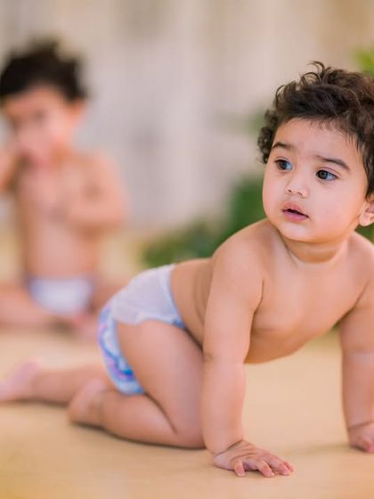 Using depth of field in our minimalist greenery set. This technique allows your photographer to focus on one twin while the other creates a beautiful, soft background element.