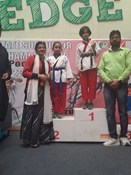 Sarisha Jha on the podium after winning a Silver medal in Poomsae at the 38th Sub Junior Delhi State Taekwondo Championship. It is rewarding to see her hard work recognized.