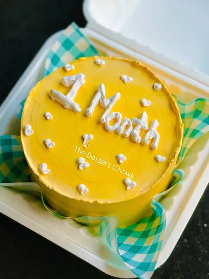 A bright and sunny yellow bento cake to celebrate a one-month milestone.