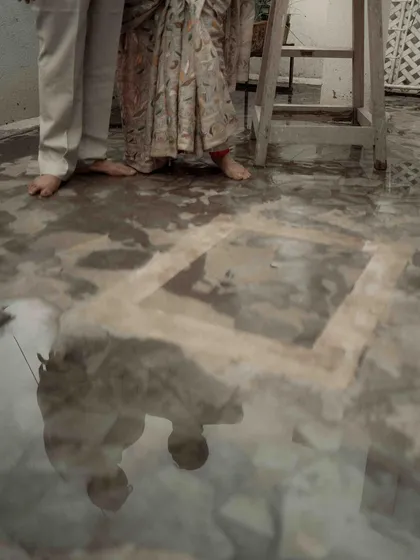 An artistic shot of their reflection in the water on the terrace floor. I saw this as a metaphor for their love, reflecting their journey together in a unique and beautiful way.