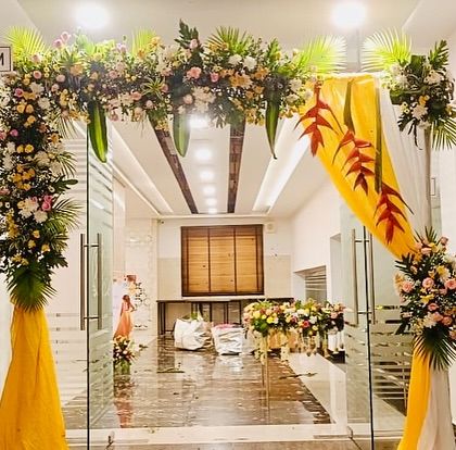 An elegant floral archway at the entrance to the 'Board Room' where the half saree ceremony is being held.