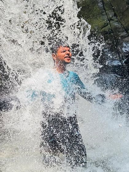 A refreshing dip directly under one of the smaller waterfalls at Hogenakkal. The force of the water is incredible.