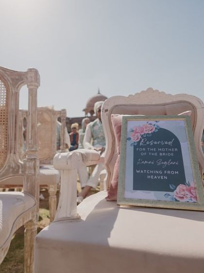 A reserved seat in memory of the bride's mother, a heartfelt detail to ensure her presence was felt on this special day.