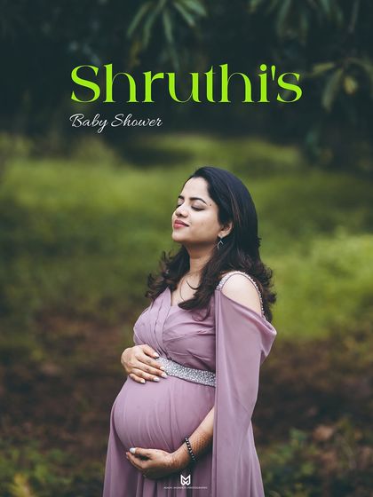 A beautiful solo portrait celebrating the mother's journey. Her serene expression and the gentle hold on her belly tell a story of love and anticipation.